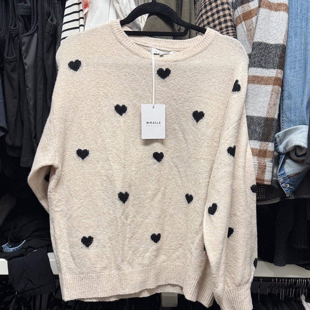 Miracle Cream Sweater with Black Heart Pattern